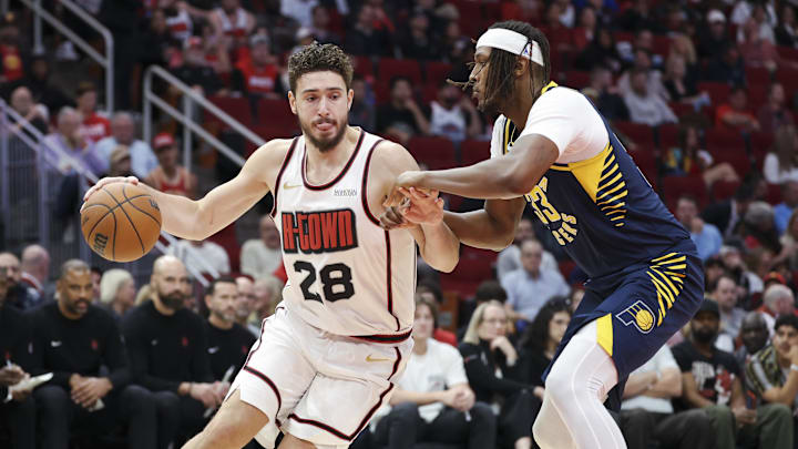 Nov 20, 2024; Houston, Texas, USA; Houston Rockets center Alperen Sengun (28) dribbles the ball as Indiana Pacers center Myles Turner (33) defends during the second quarter at Toyota Center. Mandatory Credit: Troy Taormina-Imagn Images Nov 20, 2024; Houston, Texas, USA; Houston Rockets center Alperen Sengun (28) dribbles the ball as Indiana Pacers center Myles Turner (33) defends during the second quarter at Toyota Center. Mandatory Credit: Troy Taormina-Imagn Images