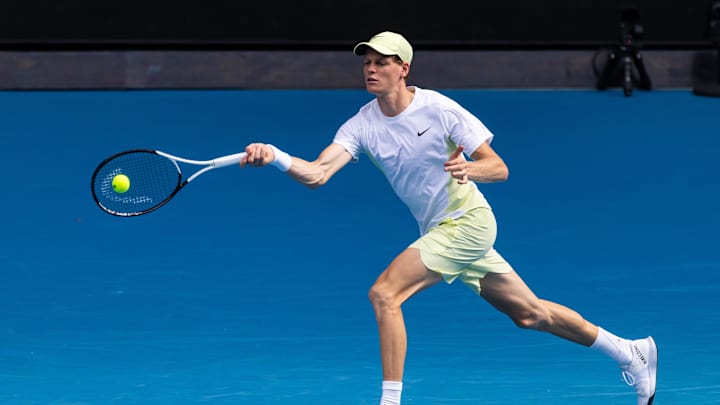 Jan 20, 2025; Melbourne, Victoria, Australia; Jannik Sinner of Italy hits a forehand during his match against Holger Rune of Denmark in the fourth round of the men's singles at the 2025 Australian Open at Melbourne Park. Mandatory Credit: Mike Frey-Imagn Images