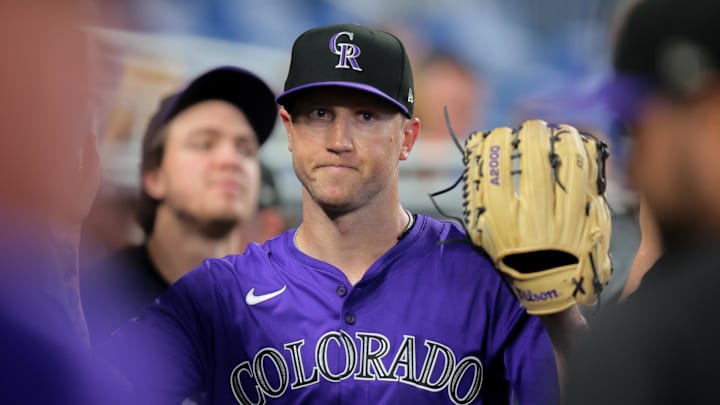 Kyle Freeland high-fives teammates after exiting against the Marlins.