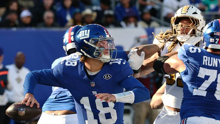 Oct 18, 2026; East Rutherford, New Jersey, USA; New York Giants quarterback J.J. McCarthy (18) throws a pass against New Orleans Saints defensive end Chase Young (99) during the fourth quarter at MetLife Stadium. Oct 18, 2026; East Rutherford, New Jersey, USA; New York Giants quarterback J.J. McCarthy (18) throws a pass against New Orleans Saints defensive end Chase Young (99) during the fourth quarter at MetLife Stadium.