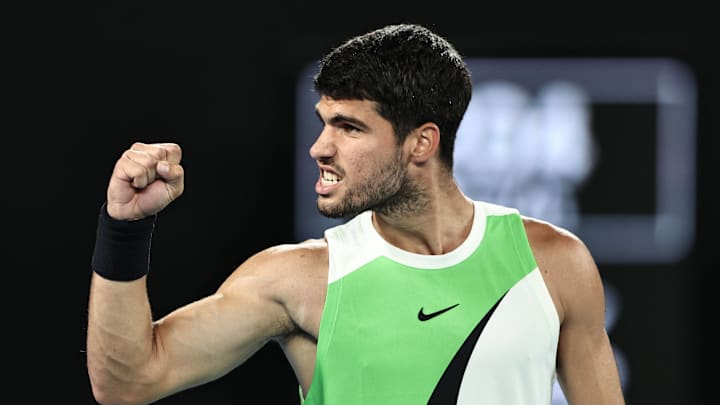Carlos Alcaraz celebrates after defeating Alex de Minaur in the quarterfinals of the Australian Open.