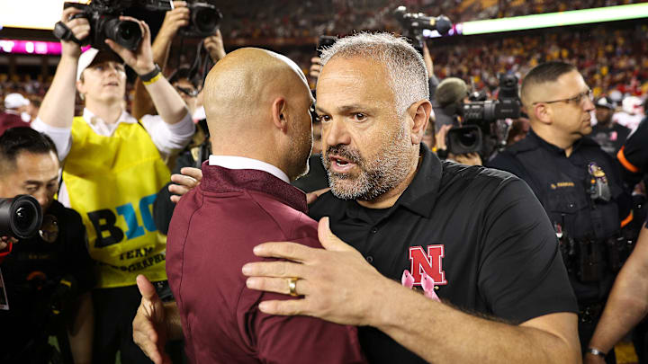 Oct 17, 2025; Minneapolis, Minnesota, USA; Nebraska Cornhuskers head coach Matt Rhule and Minnesota Golden Gophers head coach P.J. Fleck shake hands after the game at Huntington Bank Stadium. Mandatory Credit: Matt Krohn-Imagn Images