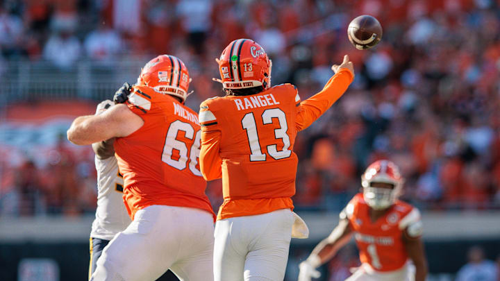 Oct 5, 2024; Stillwater, Oklahoma, USA; Oklahoma State Cowboys quarterback Garret Rangel (13) throws a pass to wide receiver De'Zhaun Stribling (1) against the West Virginia Mountaineers during the fourth quarter at Boone Pickens Stadium. Mandatory Credit: William Purnell-Imagn Images Oct 5, 2024; Stillwater, Oklahoma, USA; Oklahoma State Cowboys quarterback Garret Rangel (13) throws a pass to wide receiver De'Zhaun Stribling (1) against the West Virginia Mountaineers during the fourth quarter at Boone Pickens Stadium. Mandatory Credit: William Purnell-Imagn Images