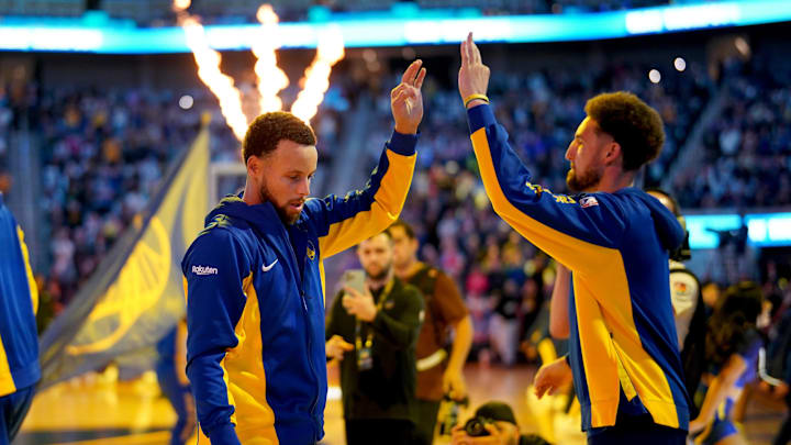 Golden State Warriors guard Stephen Curry (30) exchanges high fives with guard Klay Thompson (11) before the start of the game against the Sacramento Kings at the Chase Center.