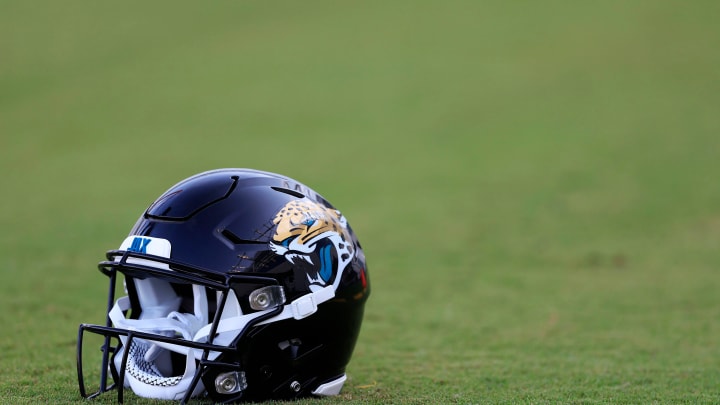 A Jacksonville Jaguars helmet lies on the turf Wednesday, July 26, 2023 at Miller Electric Center at EverBank Stadium in Jacksonville, Fla. Today marked the first day of training camp for the Jacksonville Jaguars.