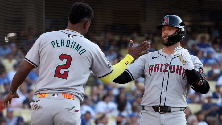 Jul 4, 2024; Los Angeles, California, USA; Arizona Diamondbacks first baseman Christian Walker (53) celebrates with shortstop Geraldo Perdomo (2) after a home run during the first inning against the Los Angeles Dodgers at Dodger Stadium. Mandatory Credit: Jason Parkhurst-USA TODAY Sports Jul 4, 2024; Los Angeles, California, USA; Arizona Diamondbacks first baseman Christian Walker (53) celebrates with shortstop Geraldo Perdomo (2) after a home run during the first inning against the Los Angeles Dodgers at Dodger Stadium. Mandatory Credit: Jason Parkhurst-USA TODAY Sports