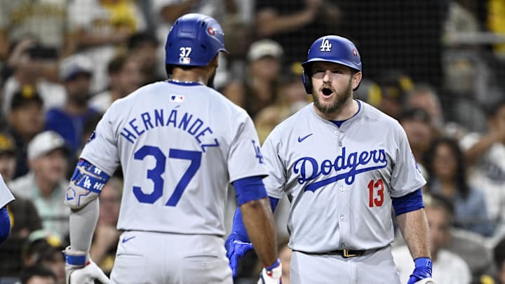 Oct 8, 2024; San Diego, California, USA; Los Angeles Dodgers outfielder Teoscar Hernandez (37) celebrates with Los Angeles Dodgers third baseman Max Muncy (13) after hitting a grand slam in the third inning against the San Diego Padres during game three of the NLDS for the 2024 MLB Playoffs at Petco Park.  Mandatory Credit: Denis Poroy-Imagn Images