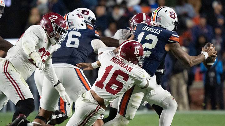 Nov 29, 2025; Auburn, Alabama, USA; Alabama defensive back Red Morgan (16) pressures Auburn quarterback Ashton Daniels (12) who throws an incomplete pass at Jordan-Hare Stadium. Alabama defeated Auburn 27-20. Mandatory Credit: Gary Cosby Jr.-Tuscaloosa News Nov 29, 2025; Auburn, Alabama, USA; Alabama defensive back Red Morgan (16) pressures Auburn quarterback Ashton Daniels (12) who throws an incomplete pass at Jordan-Hare Stadium. Alabama defeated Auburn 27-20. Mandatory Credit: Gary Cosby Jr.-Tuscaloosa News