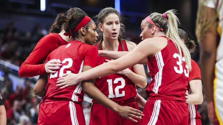 Indiana players Chloe Moore-McNeil (22), Yarden Garzon (12), Sydney Parrish (33), Lilly Meister and Shay Ciezki devise a plan during their Big Ten Tournament quarterfinal game against Southern California at Gainbridge Fieldhouse on March 7, 2025.