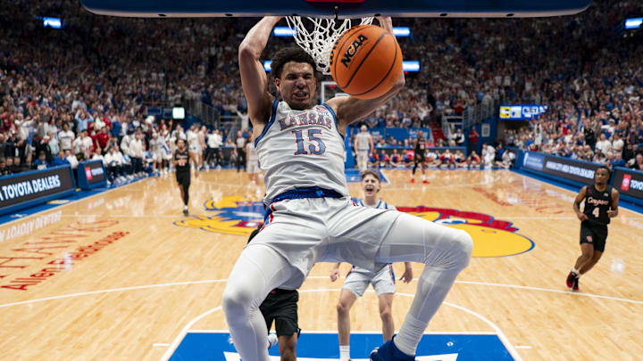 Feb 3, 2024; Lawrence, Kansas, USA; Kansas Jayhawks guard Kevin McCullar Jr. (15) dunks the ball