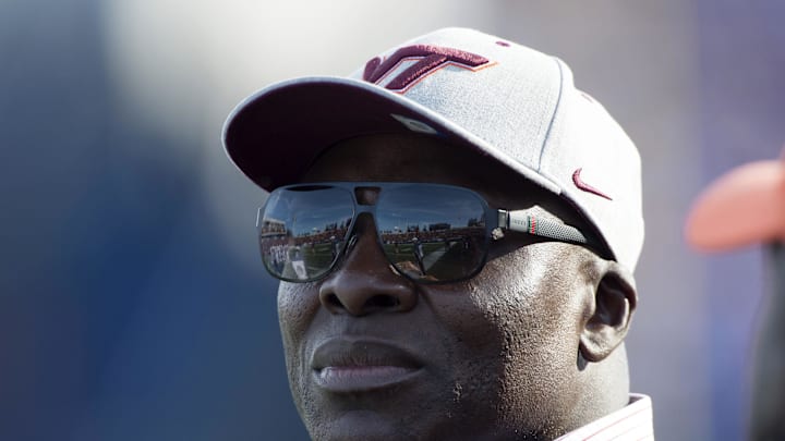 Dec 27, 2014; Annapolis, MD, USA; Virginia Tech Hokies former player Bruce Smith stands on the sidelines during the first quarter of the 2014 Military Bowl between Cincinnati Bearcats and Virginia Tech Hokies at Navy-Marine Corps Memorial Stadium. Mandatory Credit: Tommy Gilligan-USA TODAY Sports