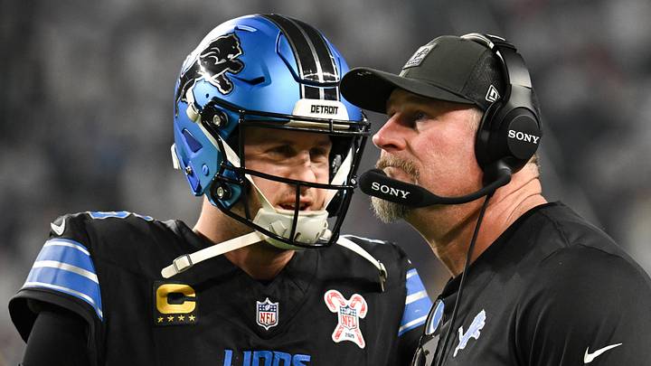 Dec 25, 2025; Minneapolis, Minnesota, USA; Detroit Lions quarterback Jared Goff (16) speaks with head coach Dan Campbell in the second quarter against the Minnesota Vikings at U.S. Bank Stadium. Mandatory Credit: Jeffrey Becker-Imagn Images