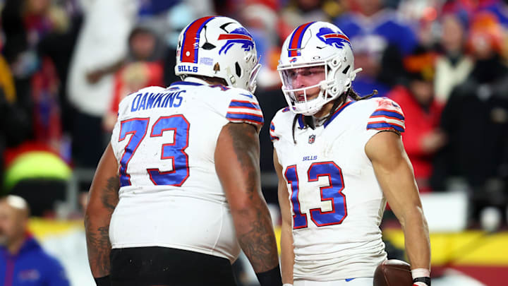 Jan 26, 2025; Kansas City, MO, USA; Buffalo Bills wide receiver Mack Hollins (13) reacts with offensive tackle Dion Dawkins (73) after scoring a touchdown against the Kansas City Chiefs during the first half in the AFC Championship game at GEHA Field at Arrowhead Stadium. Mandatory Credit: Mark J. Rebilas-Imagn Images