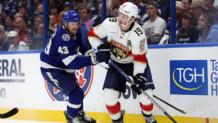 Apr 22, 2025; Tampa, Florida, USA; Florida Panthers left wing Matthew Tkachuk (19) skates with the puck as 
Tampa Bay Lightning defenseman Darren Raddysh (43) defends during the second period in game one of the first round of the 2025 Stanley Cup Playoffs at Amalie Arena. Mandatory Credit: Kim Klement Neitzel-Imagn Images