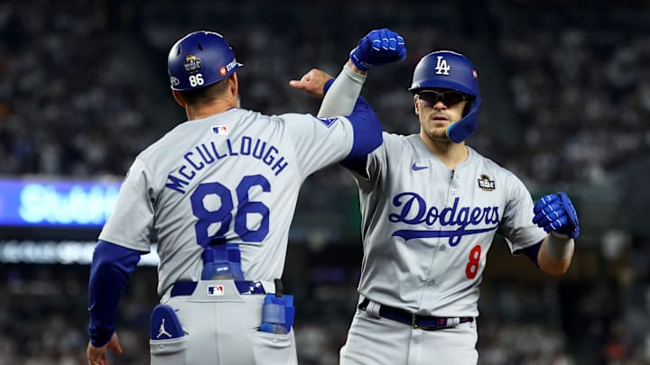 Los Angeles Dodgers third baseman Enrique Hernandez (8) celebrates with first base coach Clayton McCullough (86) during the fifth inning against the New York Yankees in game five of the 2024 MLB World Series at Yankee Stadium on Oct 30. Los Angeles Dodgers third baseman Enrique Hernandez (8) celebrates with first base coach Clayton McCullough (86) during the fifth inning against the New York Yankees in game five of the 2024 MLB World Series at Yankee Stadium on Oct 30.