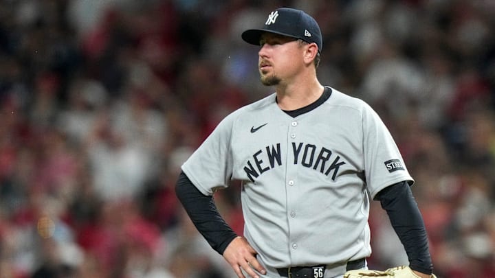 New York Yankees pitcher Mark Leiter Jr. (56) stands on the mound after Cincinnati Reds shortstop Elly De La Cruz (44) reaches third base on a wild pitch in the 11th inning of the MLB interleague game between the Cincinnati Reds and the New York Yankees at Great American Ball Park in downtown Cincinnati on Tuesday, June 24, 2025. The Reds won 5-4 in 11 innings.