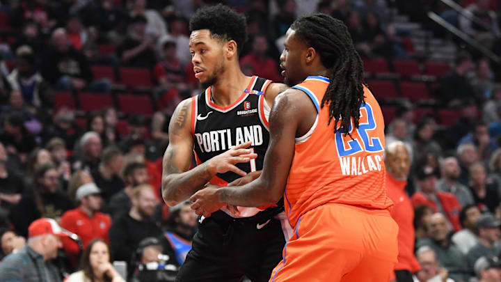 Nov 1, 2024; Portland, Oregon, USA; Portland Trail Blazers guard Anfernee Simons (1) takes a defensive position against Oklahoma City Thunder guard Cason Wallace (22) during the second quarter at Moda Center. Mandatory Credit: Brian Murphy-Imagn Images