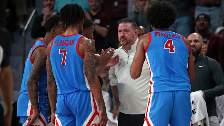Feb 21, 2024; Starkville, Mississippi, USA; Mississippi Rebels head coach Chris Beard huddles with
