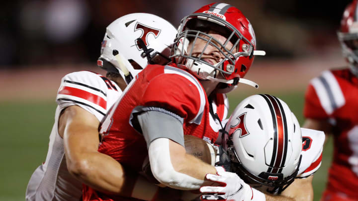 Madison County's Logan Kinder (24) takes a big hit from North Oconee's Brooks Thompson (3) during a GHSA high school football game in Danielsville, Ga., on Friday, Sept. 15, 2023. North Oconee won 38-8.