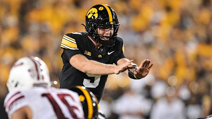 Sep 13, 2025; Iowa City, Iowa, USA; Iowa Hawkeyes quarterback Hank Brown (9) gets ready for the snap against the Massachusetts Minutemen during the fourth quarter at Kinnick Stadium. Mandatory Credit: Jeffrey Becker-Imagn Images