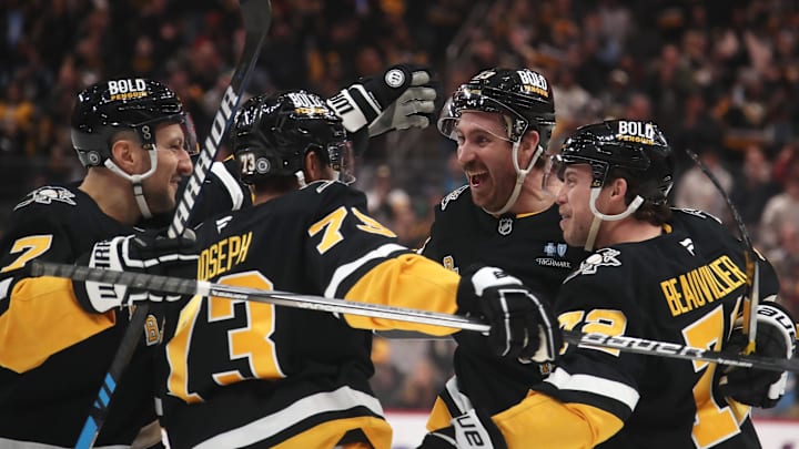 Feb 4, 2025; Pittsburgh, Pennsylvania, USA;  Pittsburgh Penguins defenseman Vincent Desharnais (7) and defenseman P.O Joseph (73) and left wing Anthony Beauvillier (72) congratulate right wing Kevin Hayes (13) on his goal against the New Jersey Devilsduring the third period at PPG Paints Arena. Mandatory Credit: Charles LeClaire-Imagn Images