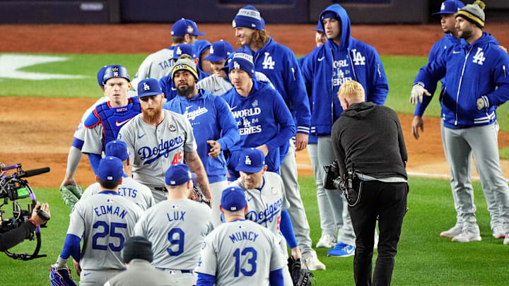 Oct 28, 2024; New York, New York, USA; The Los Angeles Dodgers celebrate with pitcher Michael Kopech (45) after defeating the New York Yankees in game three of the 2024 MLB World Series at Yankee Stadium. Mandatory Credit: Robert Deutsch-Imagn Images
