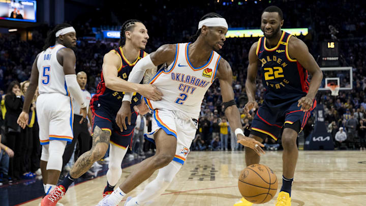 Nov 27, 2024; San Francisco, California, USA; Oklahoma City Thunder guard Shai Gilgeous-Alexander (2) gets possession against the Golden State Warriors during the fourth quarter at Chase Center. Mandatory Credit: John Hefti-Imagn Images Nov 27, 2024; San Francisco, California, USA; Oklahoma City Thunder guard Shai Gilgeous-Alexander (2) gets possession against the Golden State Warriors during the fourth quarter at Chase Center. Mandatory Credit: John Hefti-Imagn Images