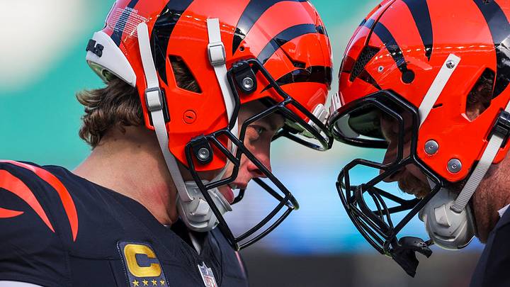 Jan 4, 2026; Cincinnati, Ohio, USA; Cincinnati Bengals quarterback Joe Burrow (9) and center Ted Karras (64) bump helmets during pregame warmups against the Cleveland Browns at Paycor Stadium. Mandatory Credit: Joseph Maiorana-Imagn Images Jan 4, 2026; Cincinnati, Ohio, USA; Cincinnati Bengals quarterback Joe Burrow (9) and center Ted Karras (64) bump helmets during pregame warmups against the Cleveland Browns at Paycor Stadium. Mandatory Credit: Joseph Maiorana-Imagn Images