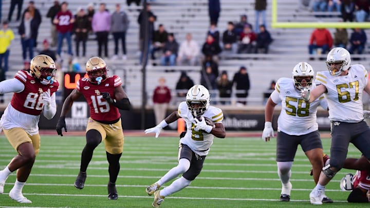 Nov 15, 2025; Chestnut Hill, Massachusetts, USA; Georgia Tech Yellow Jackets wide receiver Malik Rutherford (8) runs with the ball during the first half against the Boston College Eagles at Alumni Stadium. Mandatory Credit: Bob DeChiara-Imagn Images Nov 15, 2025; Chestnut Hill, Massachusetts, USA; Georgia Tech Yellow Jackets wide receiver Malik Rutherford (8) runs with the ball during the first half against the Boston College Eagles at Alumni Stadium. Mandatory Credit: Bob DeChiara-Imagn Images