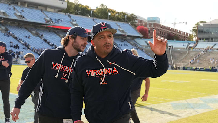 Oct 25, 2025; Chapel Hill, North Carolina, USA; Virginia Cavaliers head coach Tony Elliott runs off the field after defeating the North Carolina Tar Heels in overtime at Kenan Stadium. Mandatory Credit: Bob Donnan-Imagn Images Oct 25, 2025; Chapel Hill, North Carolina, USA; Virginia Cavaliers head coach Tony Elliott runs off the field after defeating the North Carolina Tar Heels in overtime at Kenan Stadium. Mandatory Credit: Bob Donnan-Imagn Images