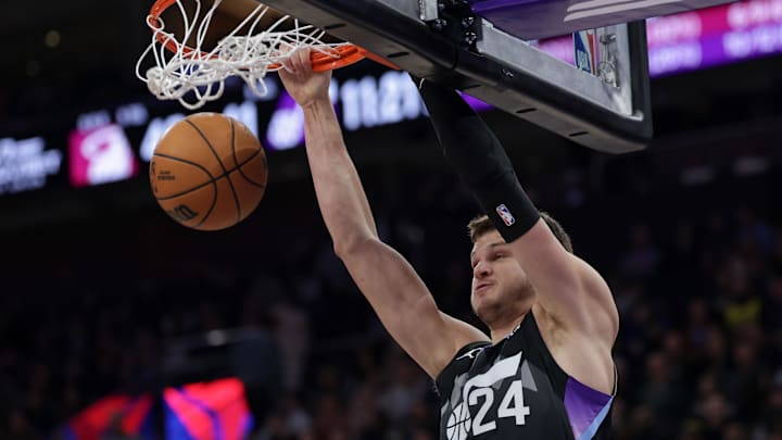 Jan 9, 2025; Salt Lake City, Utah, USA;  Utah Jazz center Walker Kessler (24) dunks the ball against the Miami Heat during the second half at Delta Center. Mandatory Credit: Chris Nicoll-Imagn Images