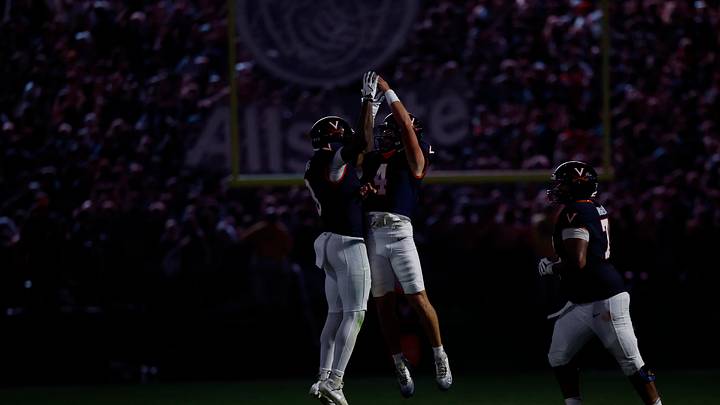 Sep 26, 2025; Charlottesville, Virginia, USA; Virginia Cavaliers quarterback Chandler Morris (4) celebrates with Cavaliers wide receiver Jayden Thomas (8) after throwing a touchdown pass against the Florida State Seminoles at Scott Stadium. Mandatory Credit: Geoff Burke-Imagn Images Sep 26, 2025; Charlottesville, Virginia, USA; Virginia Cavaliers quarterback Chandler Morris (4) celebrates with Cavaliers wide receiver Jayden Thomas (8) after throwing a touchdown pass against the Florida State Seminoles at Scott Stadium. Mandatory Credit: Geoff Burke-Imagn Images