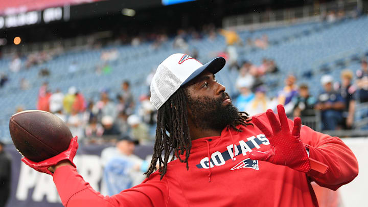 August 8, 2024; Foxborough, MA, USA;  New England Patriots linebacker Matthew Judon (9) plays catch with fans before a game against the Carolina Panthers at Gillette Stadium. Mandatory Credit: Eric Canha-USA TODAY Sports