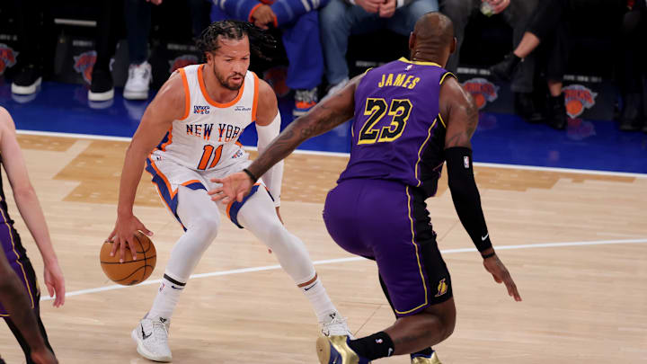Feb 1, 2025; New York, New York, USA; New York Knicks guard Jalen Brunson (11) controls the ball against Los Angeles Lakers forward LeBron James (23) during the first quarter at Madison Square Garden. Mandatory Credit: Brad Penner-Imagn Images