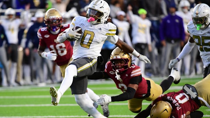 Nov 15, 2025; Chestnut Hill, Massachusetts, USA; Georgia Tech Yellow Jackets running back Malachi Hosley (0) runs the ball for a touchdown during the first half against the Boston College Eagles at Alumni Stadium. Mandatory Credit: Bob DeChiara-Imagn Images
