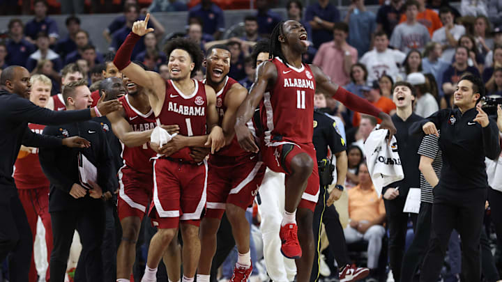 Mar 8, 2025; Auburn, Alabama, USA; Alabama Crimson Tide guard Mark Sears (1) celebrates with teammates after making the game winning shot to beat the Auburn Tigers in overtime at Neville Arena. Mandatory Credit: John Reed-Imagn Images Mar 8, 2025; Auburn, Alabama, USA; Alabama Crimson Tide guard Mark Sears (1) celebrates with teammates after making the game winning shot to beat the Auburn Tigers in overtime at Neville Arena. Mandatory Credit: John Reed-Imagn Images