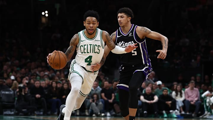 Jan 30, 2026; Boston, Massachusetts, USA; Boston Celtics guard Anfernee Simons (4) drives on Sacramento Kings guard Nique Clifford (5) during the second half at TD Garden. Mandatory Credit: Winslow Townson-Imagn Images