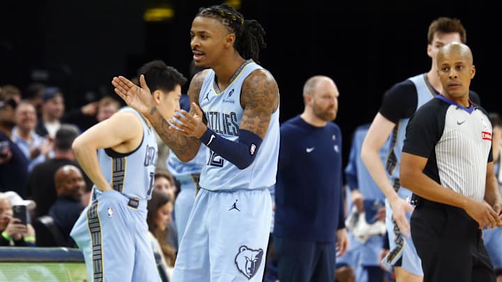 Dec 13, 2024; Memphis, Tennessee, USA; Memphis Grizzlies guard Ja Morant (12) reacts as he checks out of the game during the fourth quarter against the Brooklyn Nets at FedExForum. Mandatory Credit: Petre Thomas-Imagn Images