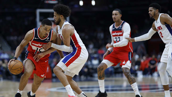 Nov 17, 2024; Washington, District of Columbia, USA; Washington Wizards guard Malcolm Brogdon (15) drives to the basket as Detroit Pistons guard Cade Cunningham (2) defends in the second half at Capital One Arena. Mandatory Credit: Geoff Burke-Imagn Images