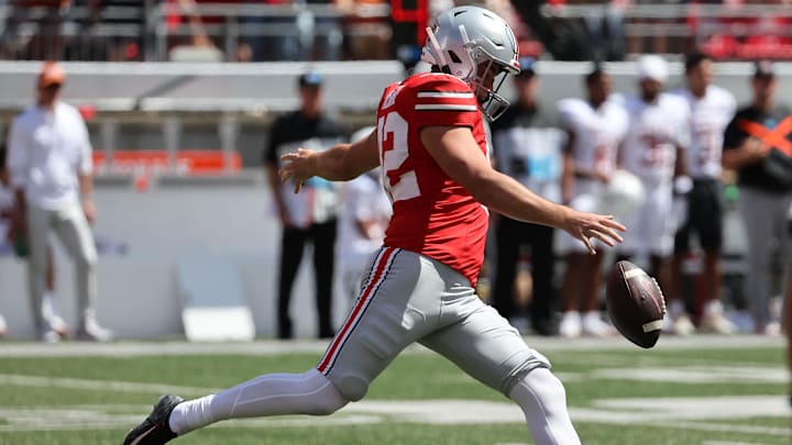 Aug 30, 2025; Columbus, Ohio, USA;Ohio State Buckeyes punter Joe McGuire (42) punts the ball against the Texas Longhorns in the first half at Ohio Stadium. Mandatory Credit: Joseph Maiorana-Imagn Images