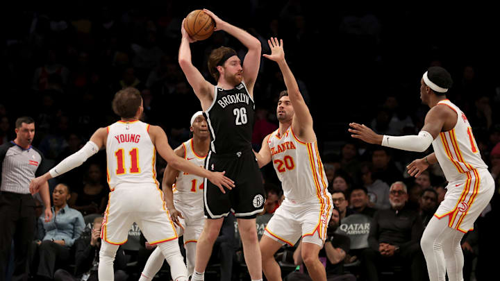Apr 10, 2025; Brooklyn, New York, USA; Brooklyn Nets forward Drew Timme (26) looks to pass the ball against Atlanta Hawks guards Trae Young (11) and Terance Mann (14) and forwards Georges Niang (20) and Onyeka Okongwu (17) during the fourth quarter at Barclays Center. Mandatory Credit: Brad Penner-Imagn Images