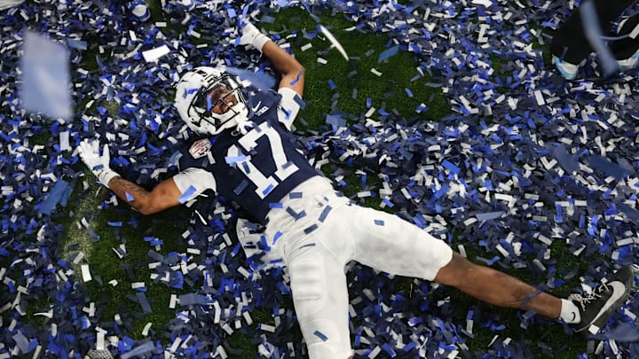Dec 31, 2024; Glendale, AZ, US; Penn State Nittany Lions cornerback Kenny Woseley Jr. (17) celebrates their 31-14 win over the Boise State Broncos in the Vrbo Fiesta Bowl at State Farm Stadium.