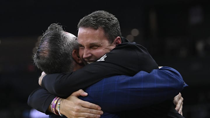 Mar 20, 2025; Providence, RI, USA; McNeese State Cowboys head coach Will Wade (right) celebrates with athletic director Heath Schroyer (left) after defeating the Clemson Tigers at Amica Mutual Pavilion. Mandatory Credit: Eric Canha-Imagn Images Mar 20, 2025; Providence, RI, USA; McNeese State Cowboys head coach Will Wade (right) celebrates with athletic director Heath Schroyer (left) after defeating the Clemson Tigers at Amica Mutual Pavilion. Mandatory Credit: Eric Canha-Imagn Images
