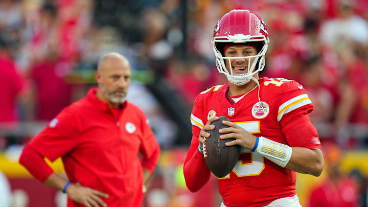 Sep 7, 2023; Kansas City, Missouri, USA; Kansas City Chiefs quarterback Patrick Mahomes (15) warms up as offensive coordinator Matt Nagy looks on prior to a game against the Detroit Lions at GEHA Field at Arrowhead Stadium. Mandatory Credit: Jay Biggerstaff-Imagn Images