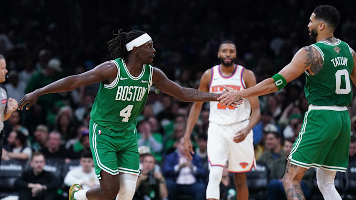 Oct 22, 2024; Boston, Massachusetts, USA; Boston Celtics guard Jrue Holiday (4) reacts after his three point basket with forward Jayson Tatum (0) against the New York Knicks in the second half at TD Garden. Mandatory Credit: David Butler II-Imagn Images Oct 22, 2024; Boston, Massachusetts, USA; Boston Celtics guard Jrue Holiday (4) reacts after his three point basket with forward Jayson Tatum (0) against the New York Knicks in the second half at TD Garden. Mandatory Credit: David Butler II-Imagn Images