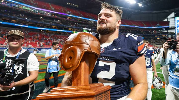 Sep 5, 2026; Atlanta, Georgia, USA; Auburn Tigers offensive lineman Cole Best (72) holds the trophy after a victory over the Baylor Bears at Mercedes-Benz Stadium. Mandatory Credit: Brett Davis-Imagn Images Sep 5, 2026; Atlanta, Georgia, USA; Auburn Tigers offensive lineman Cole Best (72) holds the trophy after a victory over the Baylor Bears at Mercedes-Benz Stadium. Mandatory Credit: Brett Davis-Imagn Images