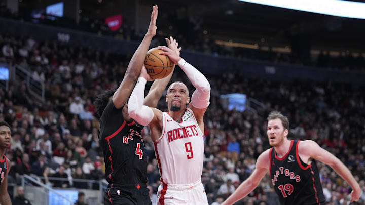 Feb 9, 2024; Toronto, Ontario, CAN; Houston Rockets forward Dillon Brooks (9) goes up to make a basket against Toronto Raptors forward Scottie Barnes (4) during the second half at Scotiabank Arena. Mandatory Credit: John E. Sokolowski-Imagn Images