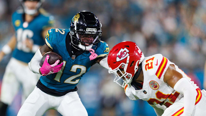 Oct 6, 2025; Jacksonville, Florida, USA; Jacksonville Jaguars wide receiver Travis Hunter (12) pushes Kansas City Chiefs defensive back Jaden Hicks (21) at EverBank Stadium. Mandatory Credit: Morgan Tencza-Imagn Images