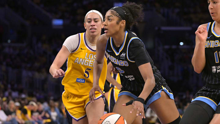 Jun 29, 2025; Los Angeles, California, USA; Chicago Sky forward Angel Reese (5) drives past Los Angeles Sparks forward Dearica Hamby (5) in the second half at Crypto.com Arena. Mandatory Credit: Jayne Kamin-Oncea-Imagn Images