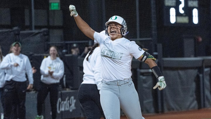 Oregon’s Braiesey Rosa celebrates her second inning home run against Florida State.